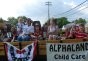 Alphaland people with banners