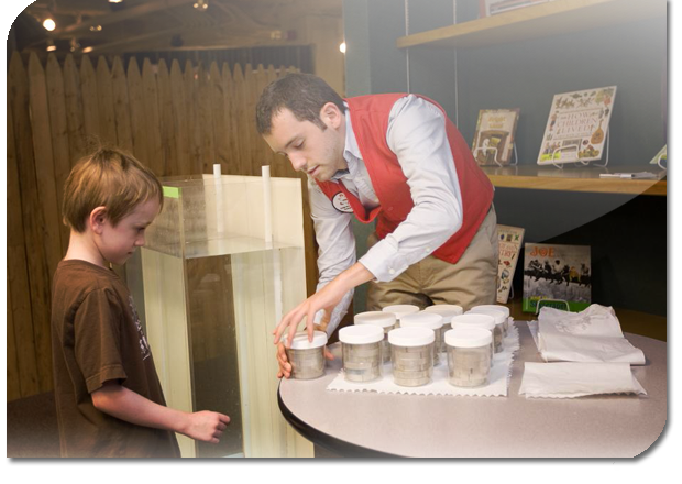 A person opening a box for a child